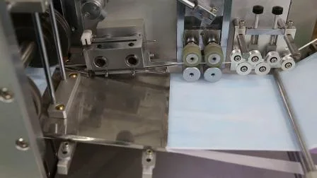 Masque médical automatique avec machine d'alimentation de boîte à cravate